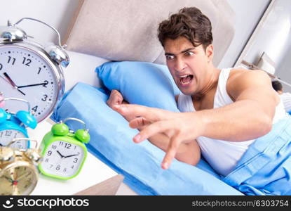 Man having trouble waking up in morning