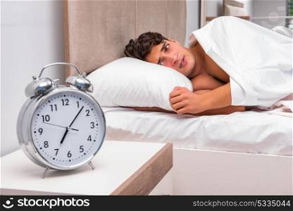 Man having trouble waking up in the morning