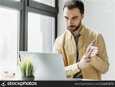 man having video call laptop