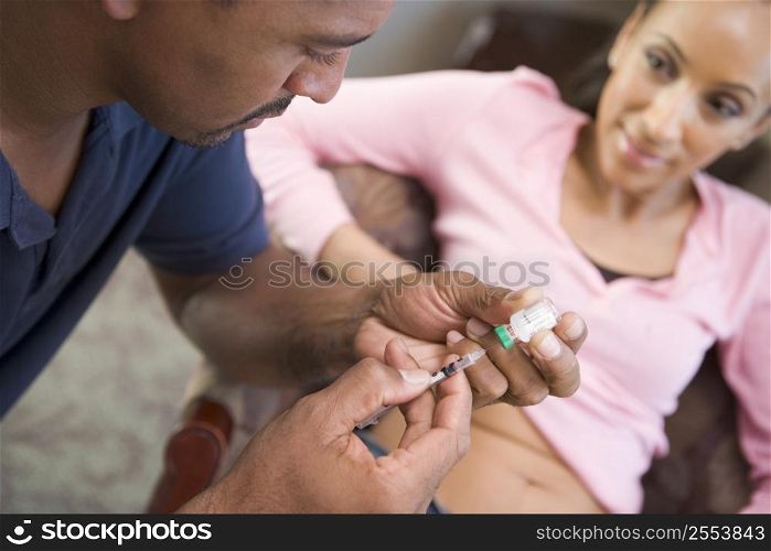 Man helping woman inject drugs to gain pregnancy (selective focus)