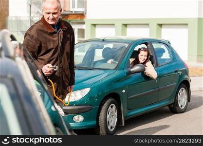 Man helping woman with her broken car problem breakdown cable