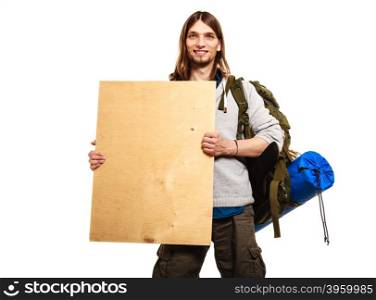 Man hiker backpacker with blank wood copy space ad. Man tourist backpacker holding blank wood banner copy space. Young guy hiker backpacking. Summer vacation travel.