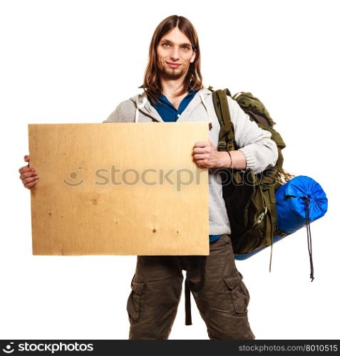 Man hiker backpacker with blank wood copy space ad. Man tourist backpacker holding blank wood banner copy space. Guy hiker backpacking.