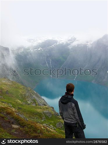 Man hiker in scandinavian landscape