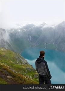 Man hiker in scandinavian landscape