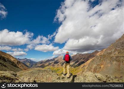 Man hiking in the Rocky mountains, Colorado in autumn season