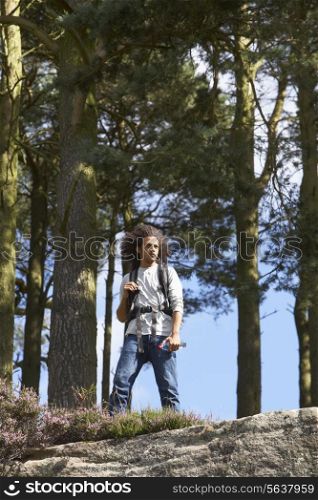 Man Hiking Through Countryside