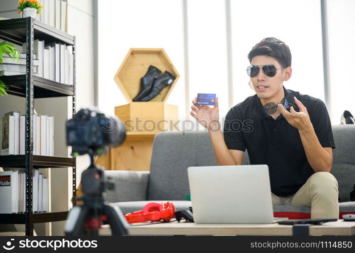 man hold credit card to camera, online marketing business concept