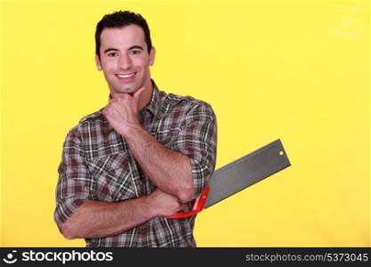 Man holding a backsaw