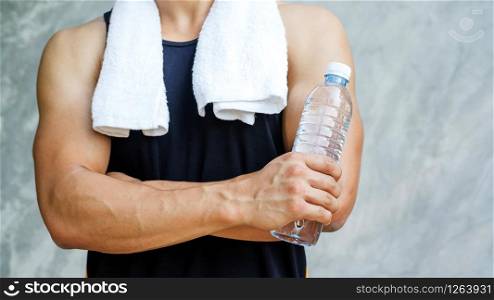 Man holding a bottle of water.