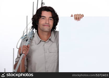 man holding a fence