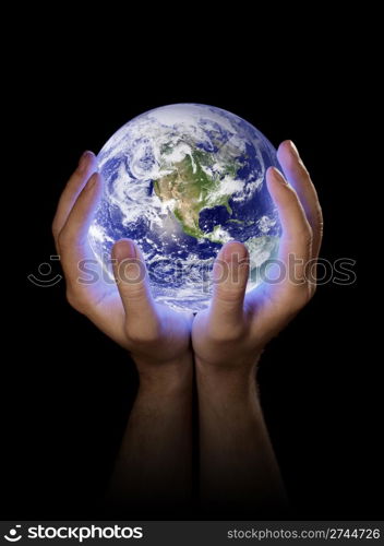 Man holding a glowing planet earth in his hands. Earth image provided by NASA.