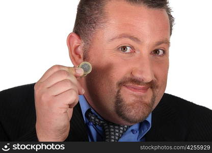 Man holding a one Euro coin