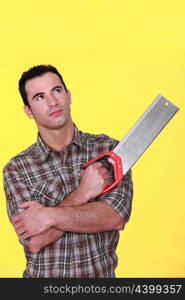 Man holding a saw