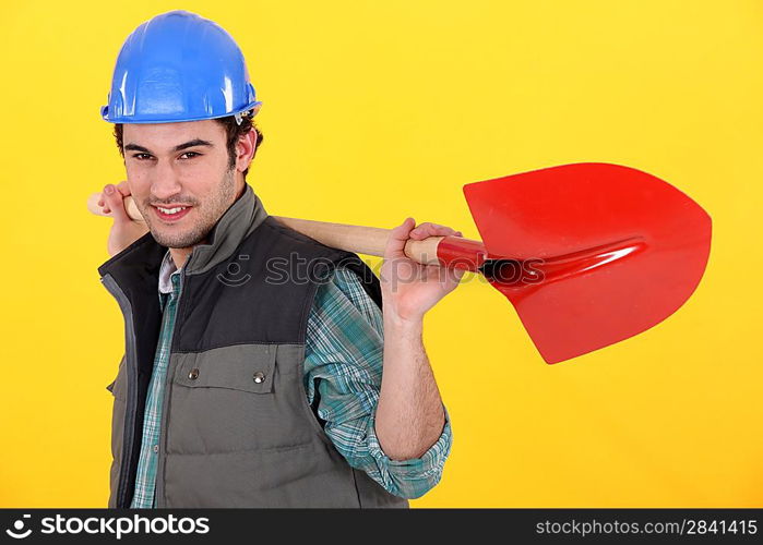 Man holding a shovel.