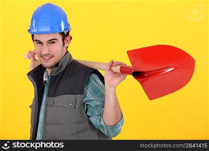 Man holding a shovel.