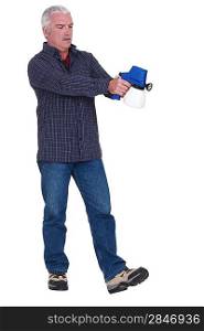 Man holding a spray gun