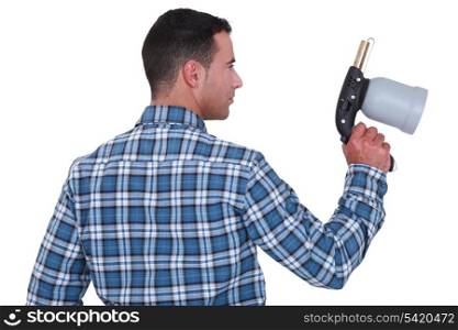 Man holding a spray gun