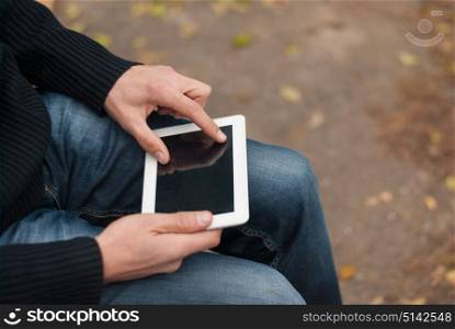 Man holding a tablet computer closeup.