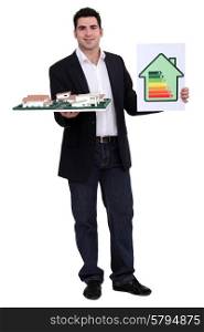 man holding an architectural model