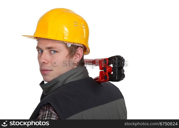 Man holding bolt cutter over shoulder