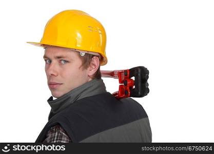 Man holding bolt cutter over shoulder