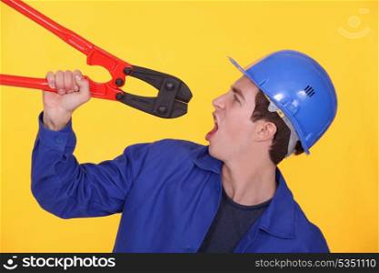 Man holding bolt cutters