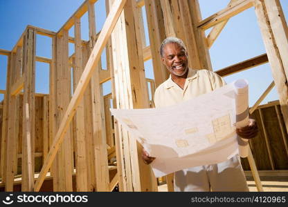 Man Holding Building Plans