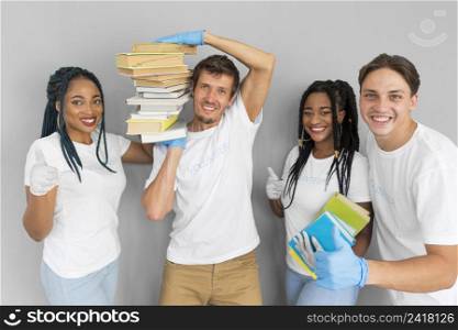 man holding bunch books his shoulders his mates