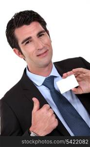 man holding business card