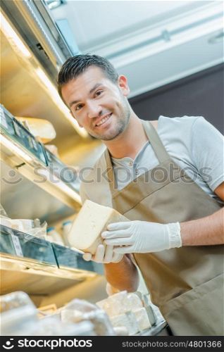 man holding cheese