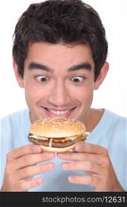 Man holding cheeseburger