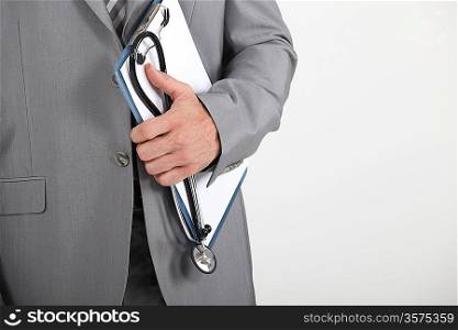 Man holding clipboard and stethoscope