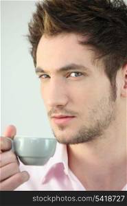 Man holding cup of coffee