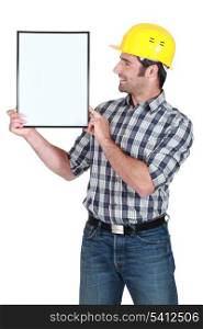 Man holding empty picture frame
