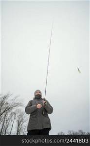 man holding fishing rod 3