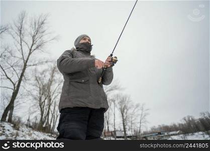 man holding fishing rod 5