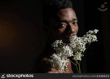 man holding flowers close up
