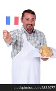 Man holding French flag and fresh chicken