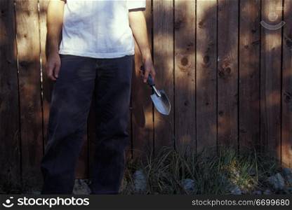Man Holding Gardening Shovel