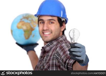 Man holding globe and light bulb