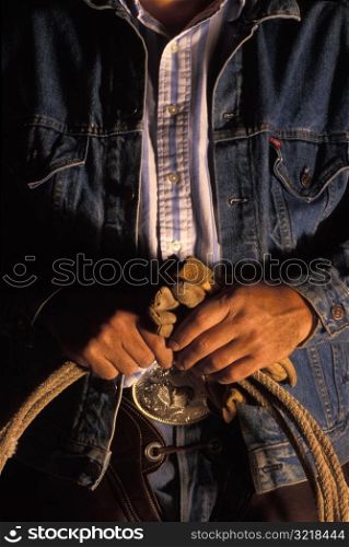 Man Holding Gloves And Lasso