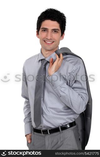 Man holding his suit jacket over his shoulder