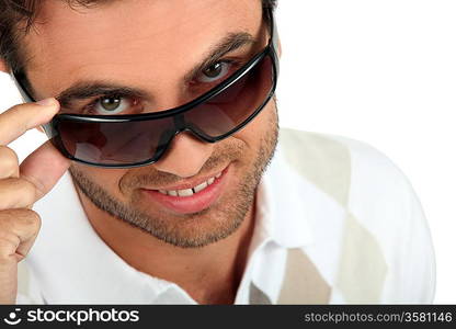 Man holding his sunglasses