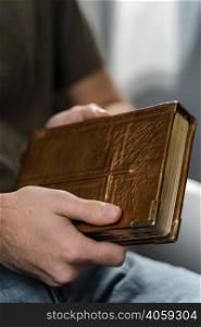 man holding holy book