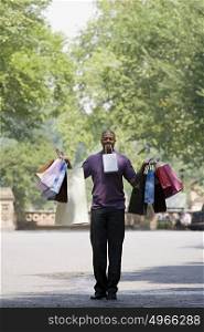 Man holding lots of bags