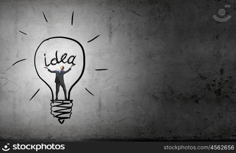 Man holding luminous idea inside light bulb. Creativity man