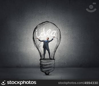 Man holding luminous idea inside light bulb. Creativity man