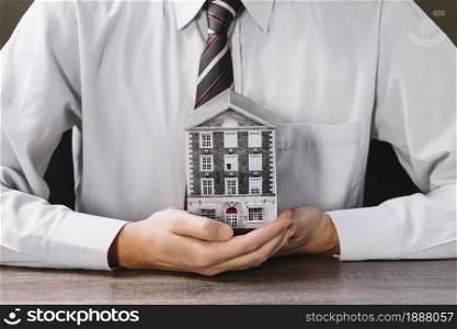 man holding miniature house hands . Resolution and high quality beautiful photo. man holding miniature house hands . High quality and resolution beautiful photo concept
