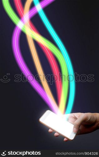 Man holding mobile phone and fiber optical light network.